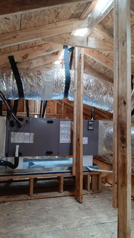 Insulated duct runs installed in an attic