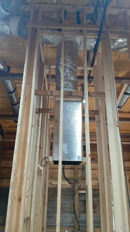 Insulated flex duct drop routed through framing in a Savannah-area build